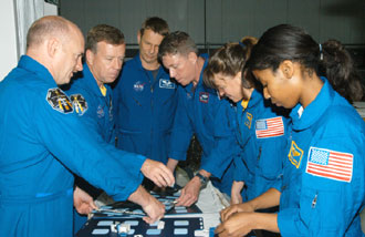 STS-121 crew looks at flight hardware during the Crew Equipment Interface Test STS-121 crew looks at flight hardware during the Crew Equipment Interface Test